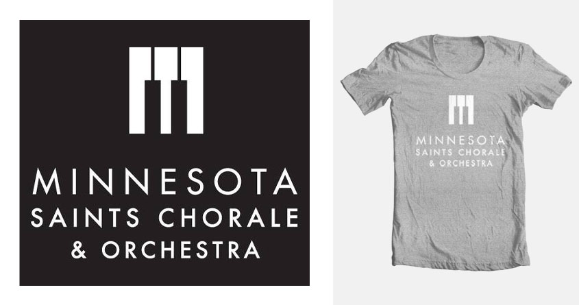 Gray T-shirt with a white logo and text saying "Minnesota Saints Choir & Orchestra" centered on the front of the shirt.